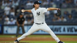 New york yankees player throwing a pitch